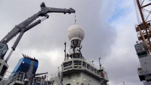 Armstrong receives its main satellite antenna during a shipyard period in Charleston earlier this year.